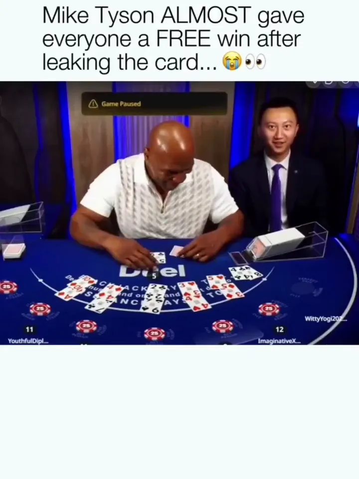 Tyson shows the table his card